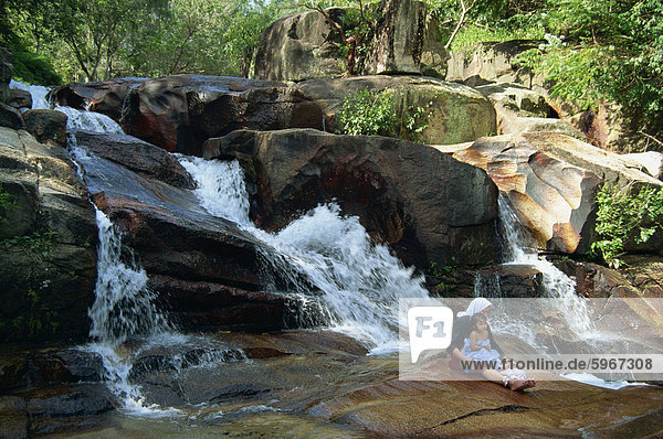 The waterfalls and rocks at Aboretum Forest Recreation Park in Penang  Malaysia  Southeast Asia  Asia