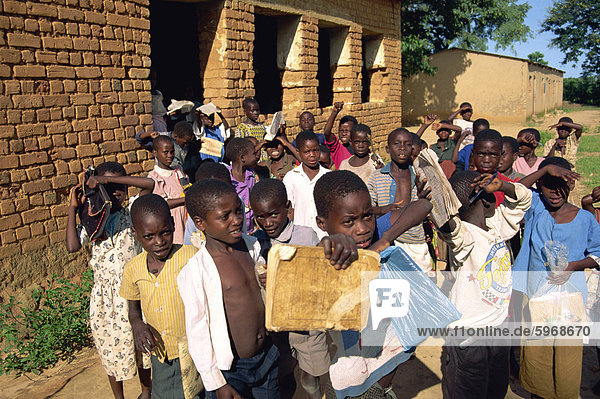 A group of children leaving the village school at Kande near Lake Malawi  Malawi  Africa
