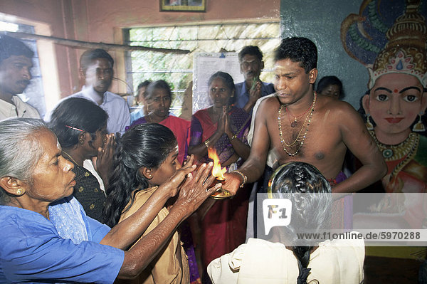 Hindus worshipping inside temple  Sri Lanka  Asia
