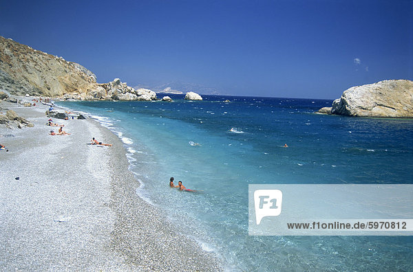 Couple in sea on the edge of Katergo Beach  on Folegandros  Cyclades Islands  Greek Islands  Greece  Europe