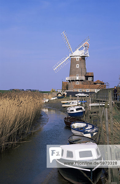 Boats on waterway and windmill  Cley next the Sea  Norfolk  England  United Kingdom  Europe
