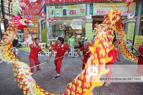 Dragon dance performers  Chinese New Year  Ho Chi Minh City  Vietnam  Indochina  Southeast Asia  Asia