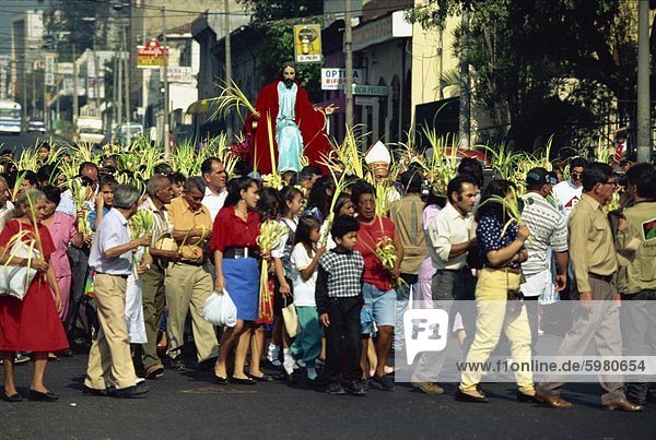 Crowds of people in the Palm Sunday procession in the centre of San Salvador  El Salvador  Central America