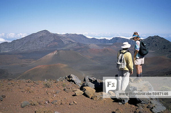Couple on rim of Haleakala volcano  Maui  Hawaiian Islands  United States of America  North America