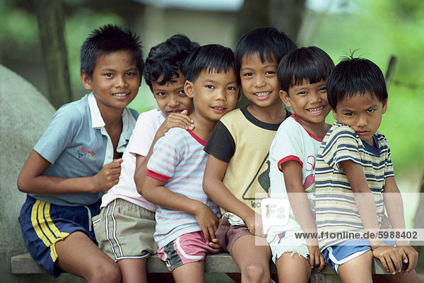 Portrait of a group of boys at Pulau Singa Besar  Malaysia  Southeast Asia  Asia
