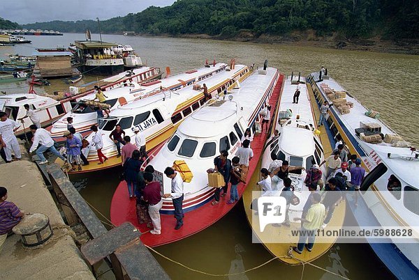 Express boats on the Rejang River at Kapit in Sarawak in north west Borneo  Malaysia  Southeast Asia  Asia