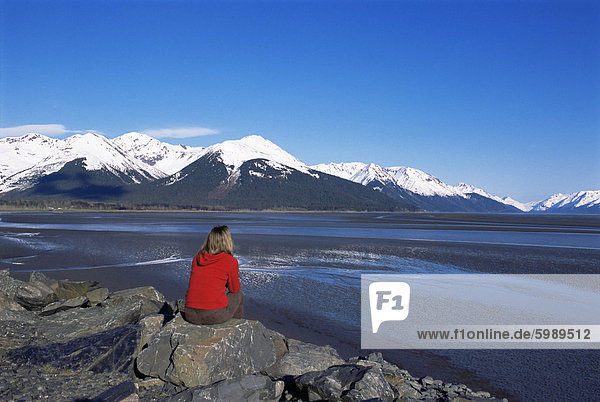 Woman looking at glaciers along the Seward Highway  Girdwood  Alaska  United States of America  North America