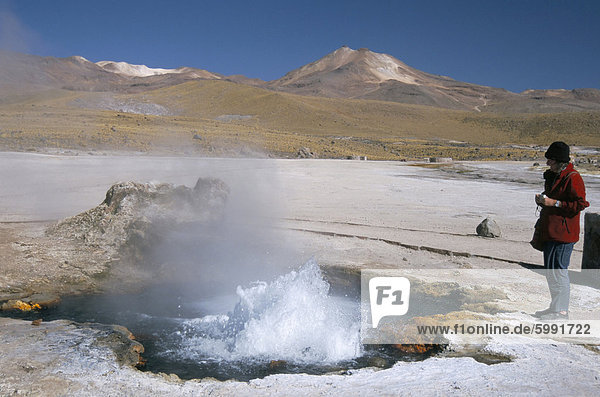 Geyser in pool in sinter basin  El Tatio geyser basin on altiplano  Atacama Desert  Chile  South America