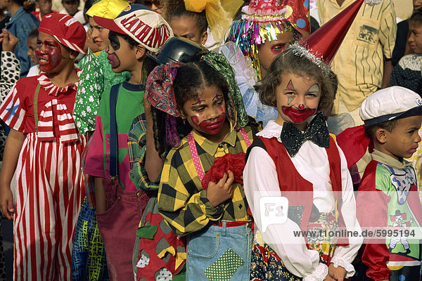 Portrait of children with painted faces during the Mardi Gras Festival in the city of Mindelo  Sao Vicente Island  Cape Verde Islands  off West Africa  Africa