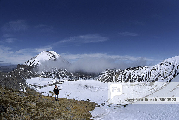 Late winter hiker on Tongariro Crossing  Mount Ngauruhoe and South Crater  Tongariro National Park  UNESCO World Heritage Site  Taupo  South Auckland  North Island  New Zealand  Pacific