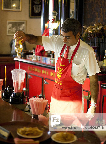 Barman mixing strawberry Daquiris in Bar El Floridita  a favourite drinking spot of late author Ernest Hemingway  Havana  Cuba  West Indies  Central America