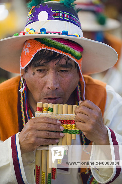 Musician playing the flute during Oruro Carnival  Oruro  Bolivia  South America