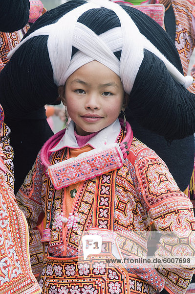 Long Horn Miao girl at lunar New Year festival celebrations in Sugao ethnic village  Guizhou Province  China  Asia