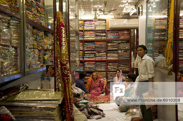 People in a sari shop in Old Delhi  India  Asia