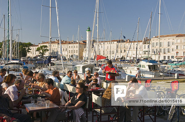 Open-air restaurant seating next to the ancient harbour at La Rochelle  Charente-Maritime  France  Europe