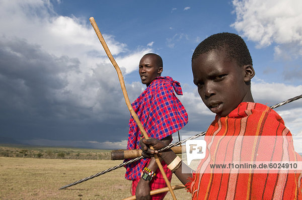 Masai boy with his father  Masai Mara  Kenya  East Africa  Africa