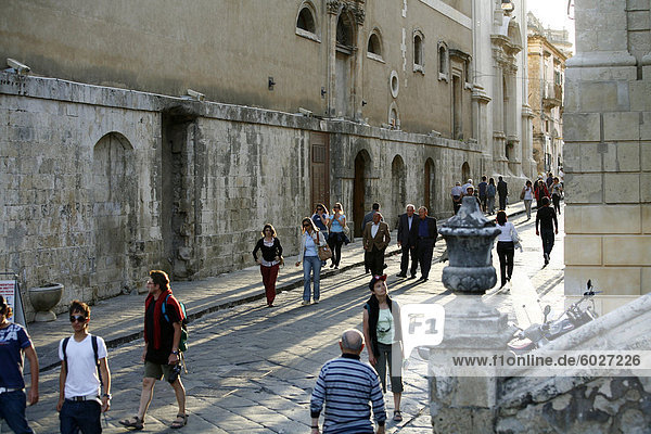 People walking by the main street in Noto  Sicily  Italy  Europe