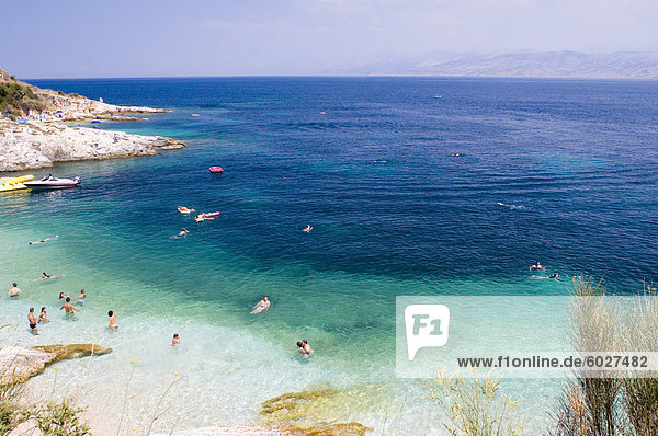 Swimmers in the sea near Kassiopi  northeast coast  Corfu  Ionian Islands  Greek Islands  Greece  Europe