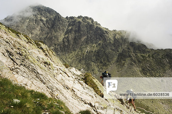 Hikers on difficult trail  High Tatras Mountains (Vyoske Tatry)  Tatra National Park  Slovakia  Europe
