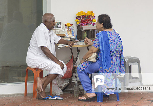 Fortune teller with a customer  Little India  Singapore  Southeast Asia  Asia
