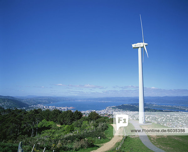 ECNZ Wind turbine generator on a hill above the city and harbour of the city of Wellington  New Zealand  Pacific