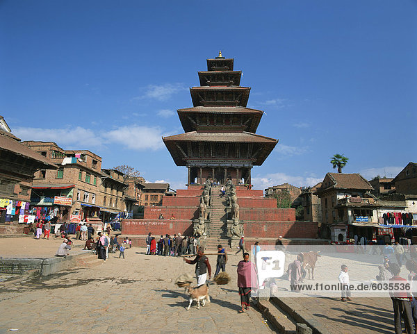 Street scene with the Siddhi Lakshmi Temple with its tiered roof  in the town of Bhaktapur  Nepal  Asia