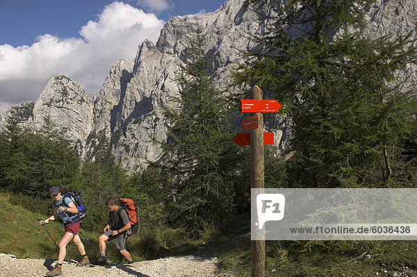 Hikers on hiking track  Vrsic Pass  Soca Valley  Triglav National Park  Julian Alps  Slovenia  Europe