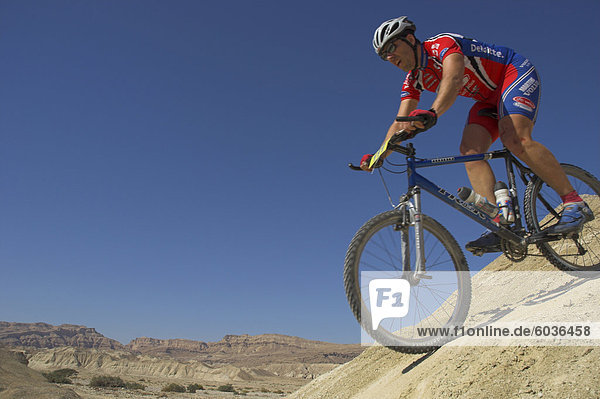 Competitior riding downhill in the Mount Sodom International Mountain Bike Race  Dead Sea area  Israel  Middle East