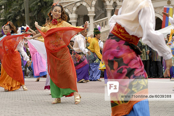 Malay female dancers wearing traditional dress at celebrations of Kuala Lumpur City Day Commemoration  Merdeka Square  Kuala Lumpur  Malaysia  Southeast Asia  Asia