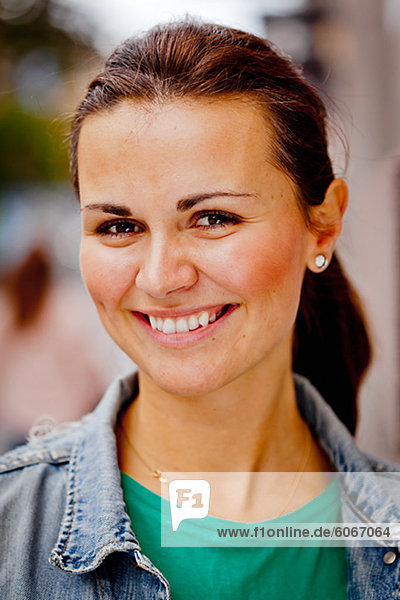 Portrait of woman smiling outdoors