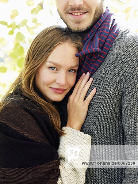 Portrait of young couple in warm clothing