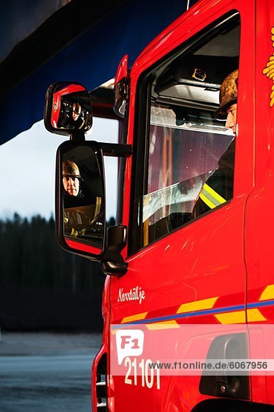 Firefighter driving fire engine