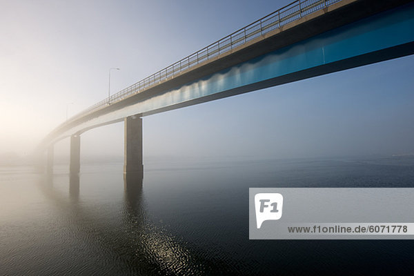 Bridge covered with fog