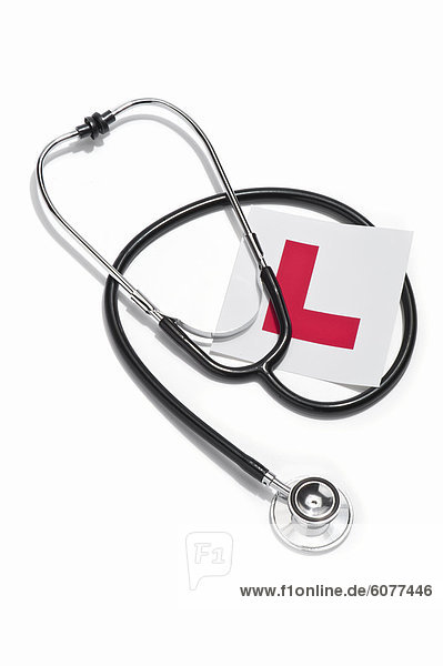 A doctors stethoscope and a Learners permit sticker