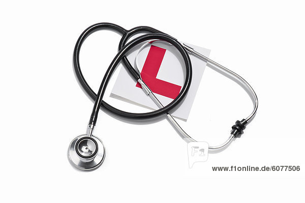 A doctors stethoscope and a Learners permit sticker