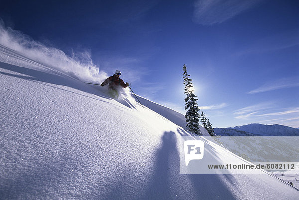 Man skiing deep powder in Utah.