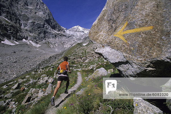 Man trail running in Val De Malatra  Courmayeur  Italy.
