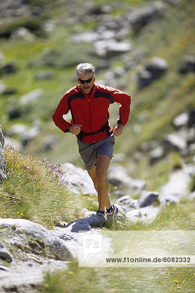 Man running in Val Ferret  Italy.