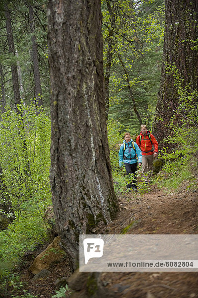 Man and woman hiking in McCloud  California.