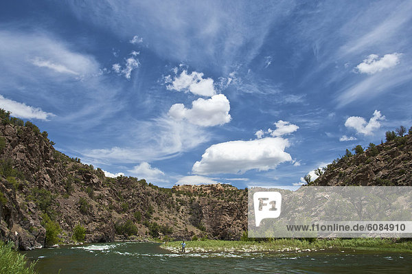 A young man fly fishes a section of the Gunnison River in Colorado.