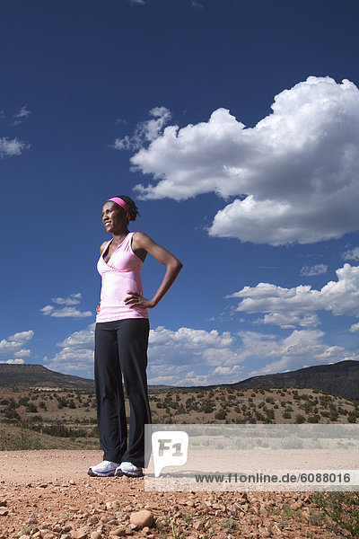 A woman rests during a run in New Mexico.