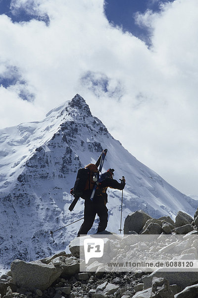 Ski mountaineer climbing on Mt. Sepu Kangri  Nyanchen Thangla Mountians  Tibet.