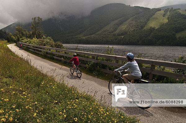 Mom and son biking along the Franconia Notch Bike Trail.