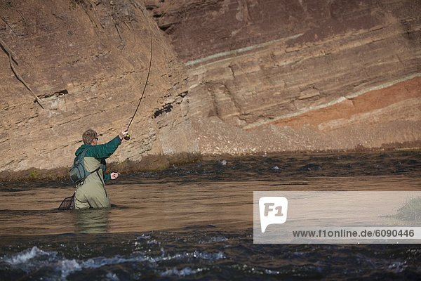 A man casts as he fly fishes the Provo River in northern Utah.