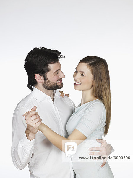 Young couple dancing  smiling