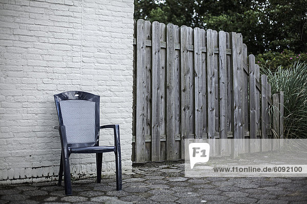 Netherlands  Chair against brick wall