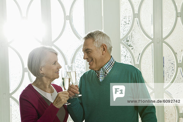 Germany Berlin Senior couple drinking champagne