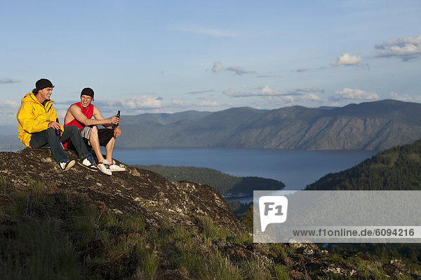 Two men enjoying the view after hiking in Idaho.