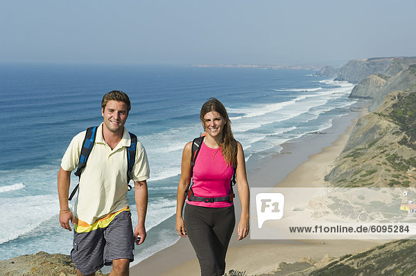 Portugal  Couple walking on beach