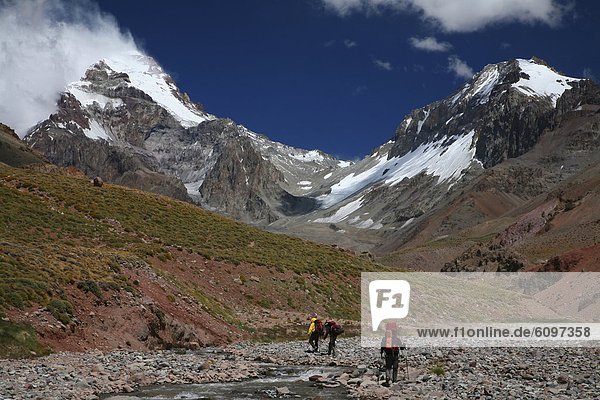 Mountaineers hiking into base camp on Aconcagua Polish Route  Andes Mountains  Argentina.